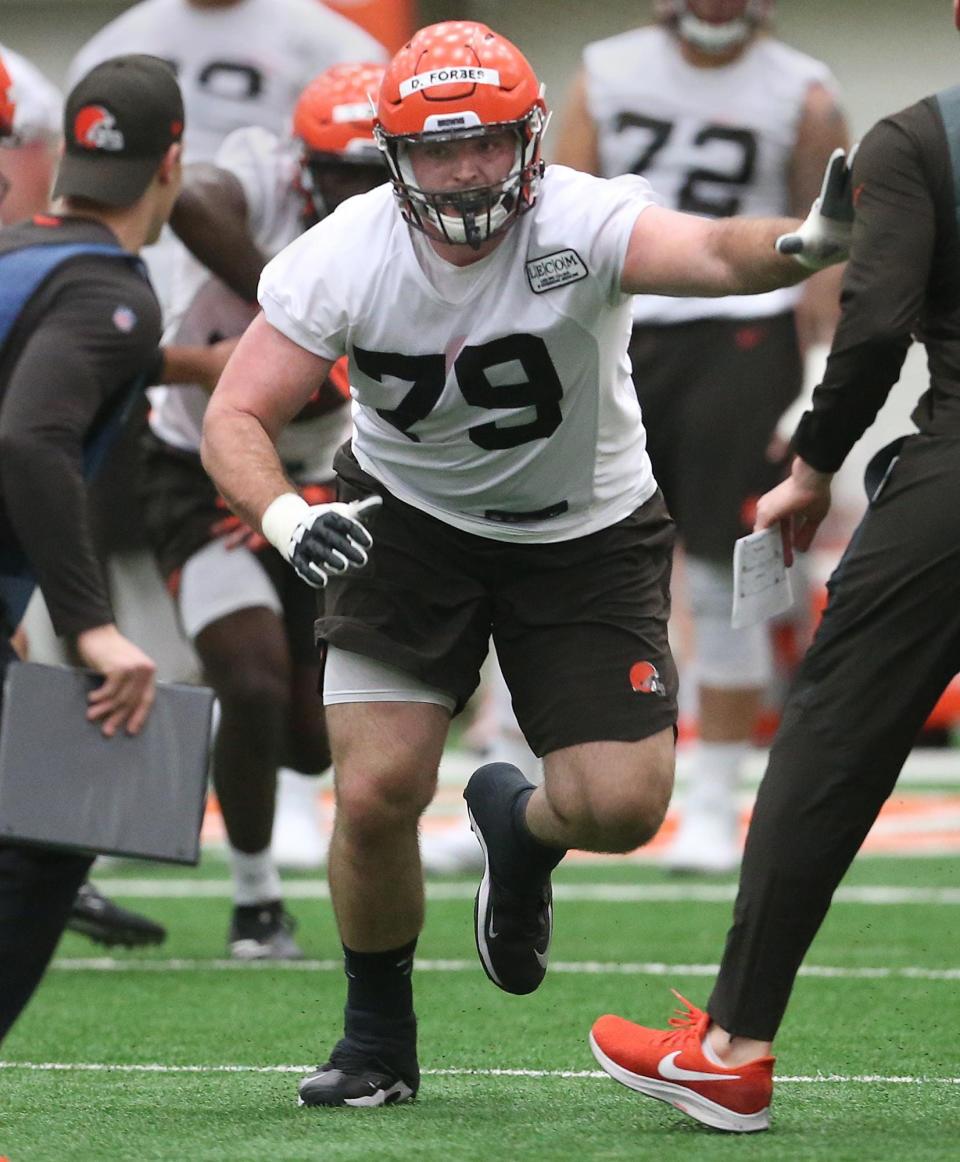 Drew Forbes works on blocking during a minicamp in Berea.