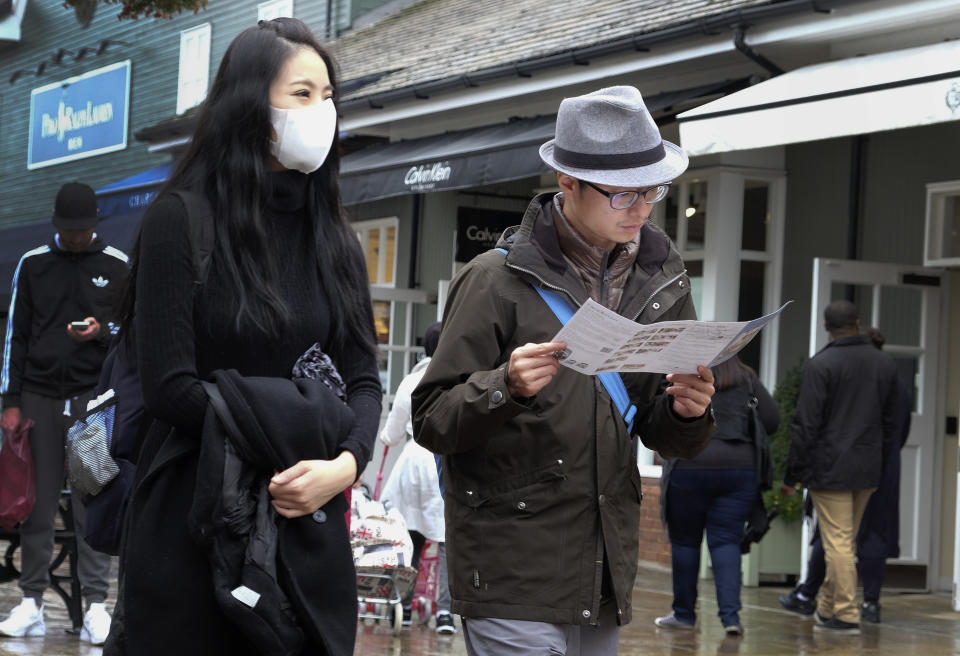 FOR STORY BY SYLVIA HUI - BRITAIN LUXURY GOODS CHINA - Shoppers at Bicester Village designer outlet centre, in Bicester, England, in this photo dated Wednesday, Aug. 26, 2015. Chinese customers have become a powerful market force in the global trade in expensive clothes, jewelry, watches, perfumes and handbags, but nobody knows how the recent turmoil in Chinese financial markets will impact on the sales of designer brands.(AP Photo/Kirsty Wigglesworth)