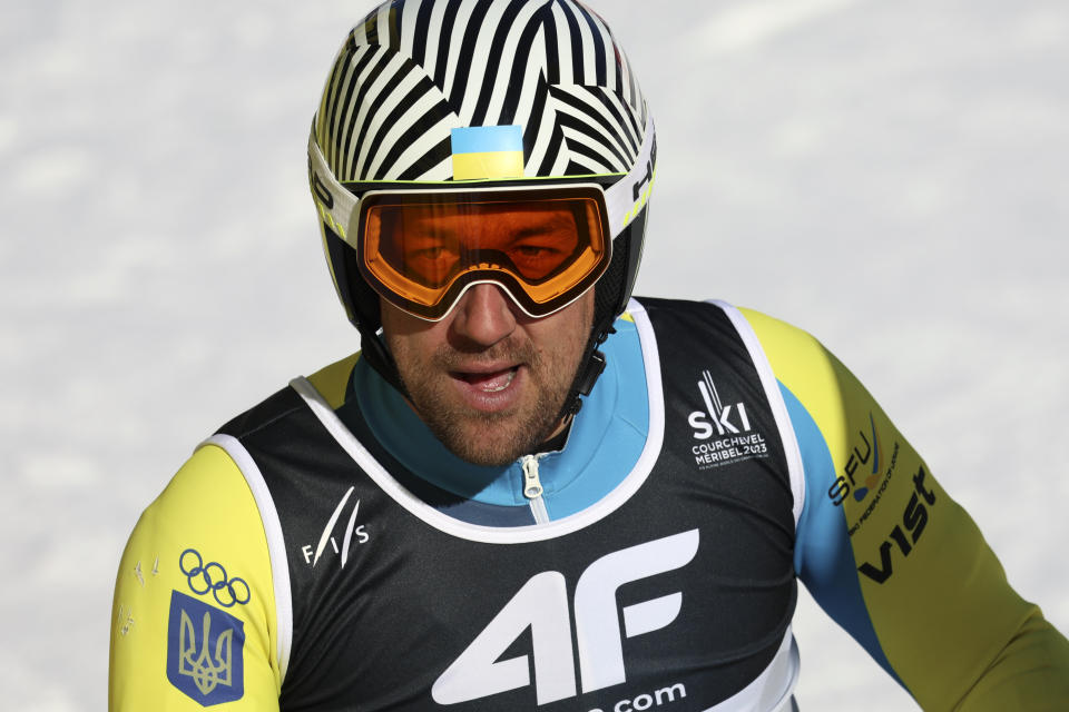 Ukraine's Ivan Kovbanyusk gets to the finish area after completing an alpine ski, men's World Championship super-G race, in Courchevel, France, Thursday, Feb. 9, 2023. (AP Photo/Marco Trovati)