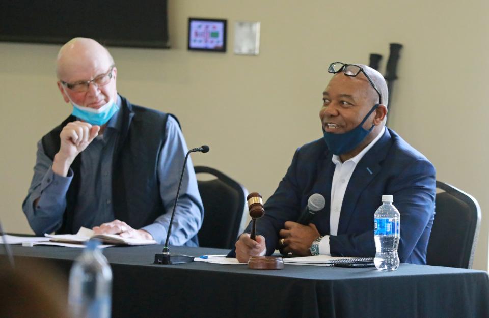 In April 2021, Columbus Zoo and Aquarium board President Keith Shumate, right, and interim zoo executive director Jerry Borin interact during a board meeting. The board met for its first regular meeting since former zoo President and CEO Tom Stalf and Chief Financial Officer Greg Bell resigned.