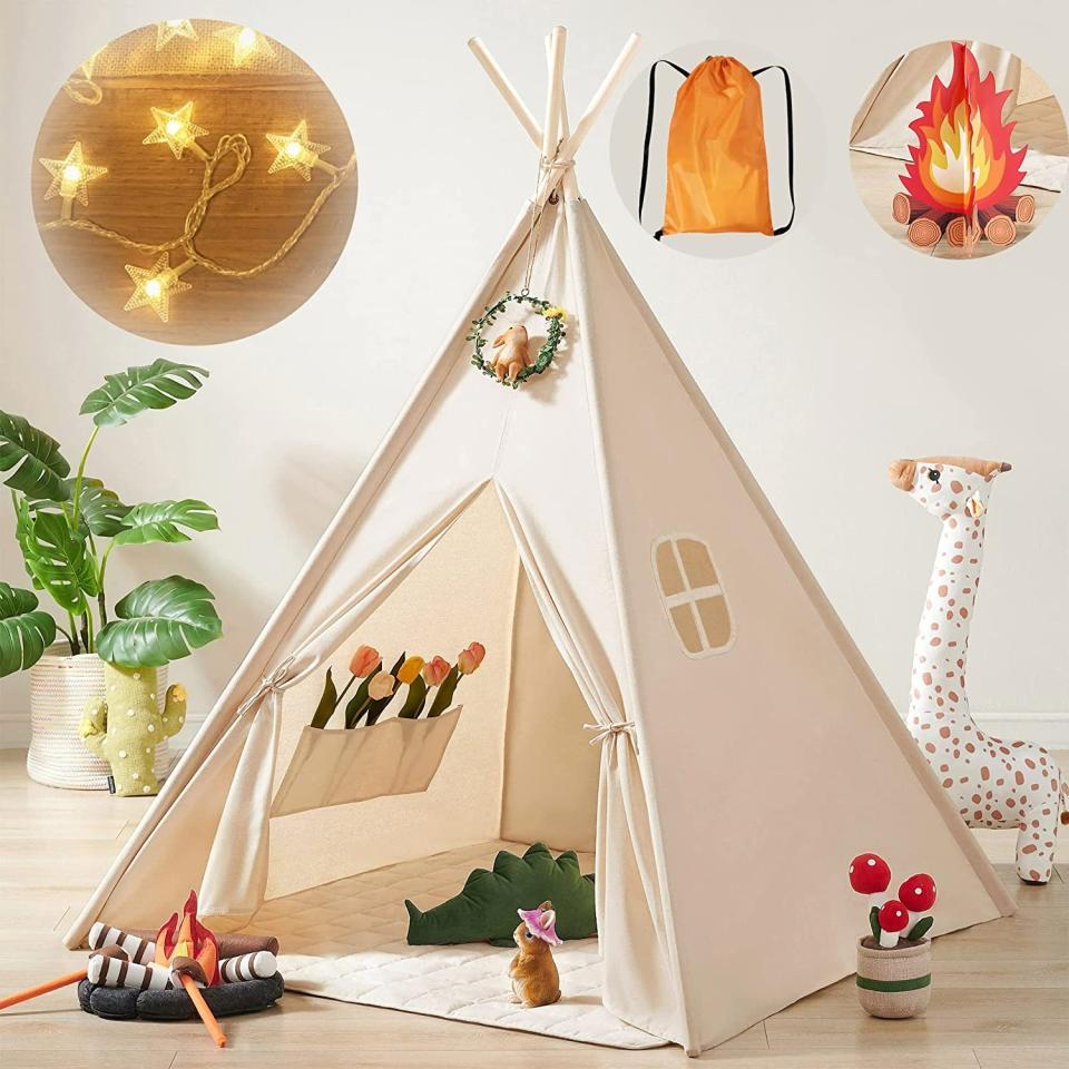 Beige kids teepee tent with faux campfire