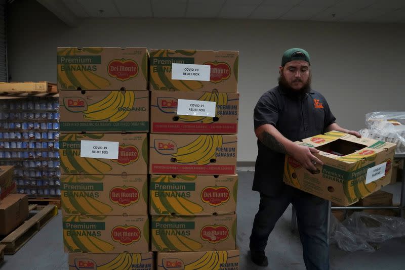 COVID-19 food relief boxes are being prepared at the South Texas Food Bank in Laredo, Texas