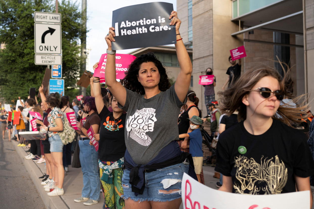 Abortion rights demonstrators gather outside of the federal courthouse in Tucson, Ariz., on Tuesday. (Rebecca Noble/Reuters)