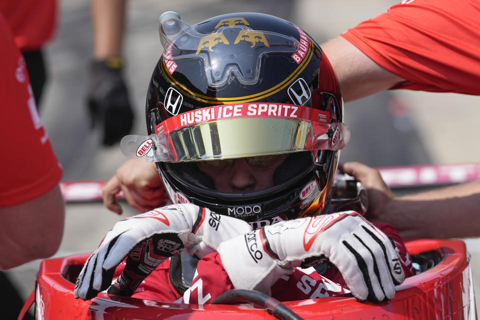 Marcus Ericsson, of Sweden, climbs out of his car during practice for the Indianapolis 500 auto race at Indianapolis Motor Speedway, Thursday, May 18, 2023, in Indianapolis. (AP Photo/Darron Cummings)