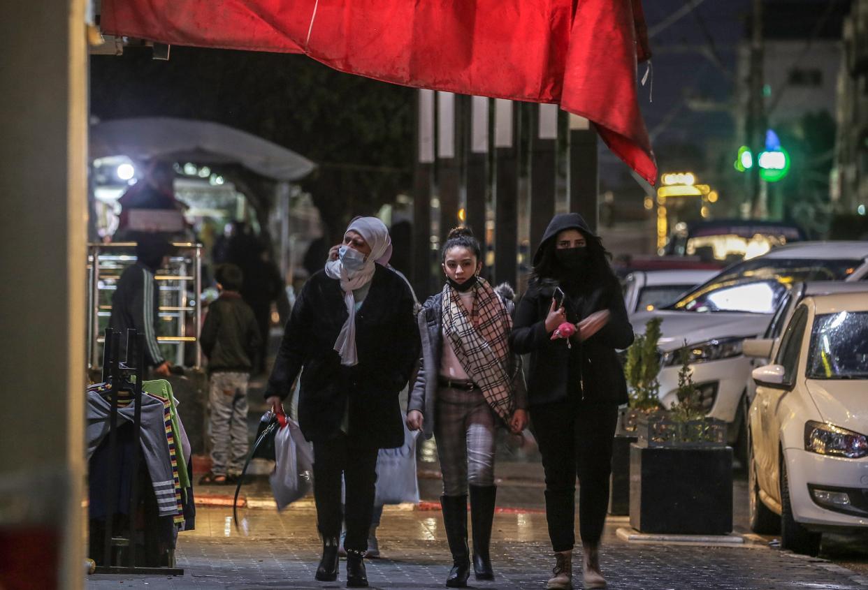 <p>Palestinians wearing face coverings during the ongoing Covid-19 pandemic</p> (EPA)