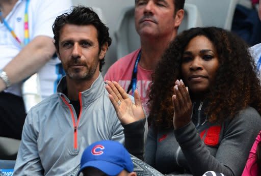 Serena Williams (right) claps next to coach Patrick Mouratoglou during a match between her sister Venus Williams and Kazakhstan's Galina Voskoboeva on day one of the Australian Open in Melbourne on January 14, 2013. Serena Williams' bid to reclaim the world number 1 ranking here this week may be boosted by a French connection which has been helping her recover from an upsetting start to the year