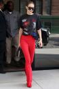 <p>In a <em>Star Wars</em> shirt, red high-waisted pants, shoes and a black bag while heading out in New York City. </p>