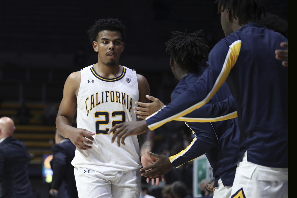 California's Andre Kelly is congratulated by teammates as he comes out of the team's NCAA college basketball game against Oregon State, during the second half Thursday, Dec. 2, 2021, in Berkeley, Calif. (AP Photo/Jed Jacobsohn)