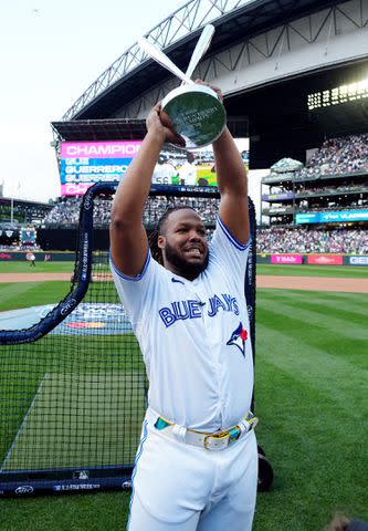 <p>Daniel Shirey/MLB Photos via Getty Images</p> Vladimir Guerrero Jr. celebrates after winning the MLB Home Run Derby in Seattle on July 10, 2023