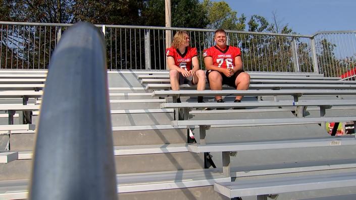 Gordan Haas (#76) sits in the new Tippecanoe student section after the bleachers were installed. Haas organized a fundraiser that raised enough money within hours for the new bleachers. (Mike Burianek/Staff)