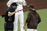 San Diego Padres manager Jayce Tingler, right, argues with umpire Mark Ripperger after being ejected during the seventh inning of the team's baseball game against the Los Angeles Dodgers, Wednesday, Aug. 5, 2020, in San Diego. (AP Photo/Gregory Bull)