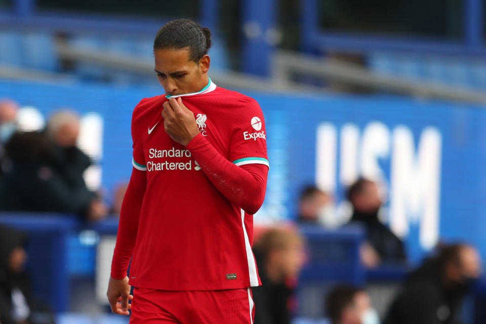 Liverpool's Dutch defender Virgil van Dijk leaves the field injured during the English Premier League football match between Everton and Liverpool at Goodison Park in Liverpool, north west England on October 17, 2020. (Photo by Catherine Ivill / POOL / AFP) / RESTRICTED TO EDITORIAL USE. No use with unauthorized audio, video, data, fixture lists, club/league logos or 'live' services. Online in-match use limited to 120 images. An additional 40 images may be used in extra time. No video emulation. Social media in-match use limited to 120 images. An additional 40 images may be used in extra time. No use in betting publications, games or single club/league/player publications. / (Photo by CATHERINE IVILL/POOL/AFP via Getty Images)