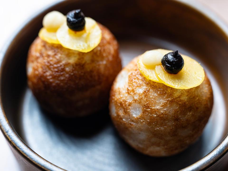 Freckled gobstoppers: the deep-fried rice and coconut dough waina (Daniel Hambury/Stella Pictures Ltd)