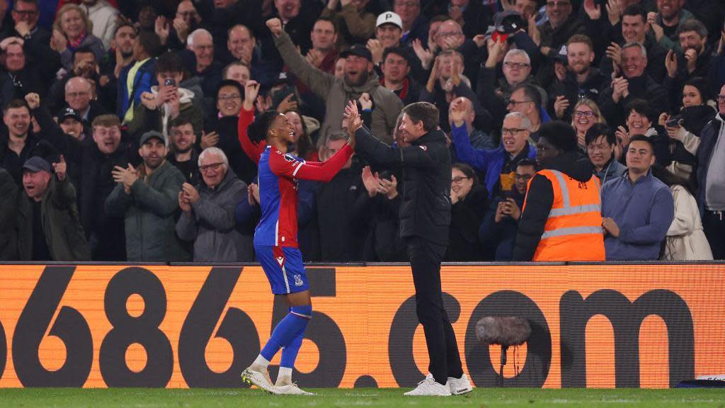 Michael Olise of Crystal Palace celebrates scoring his team's fourth goal with Oliver Glasne