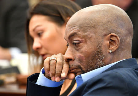 FILE PHOTO: Plaintiff Dewayne Johnson listens as attorney Brent Wisner (out of frame) speaks about his condition during the Monsanto trial in San Francisco, California, U.S., July 09, 2018. Picture taken July 09, 2018. Josh Edelson/Pool via Reuters/File Photo