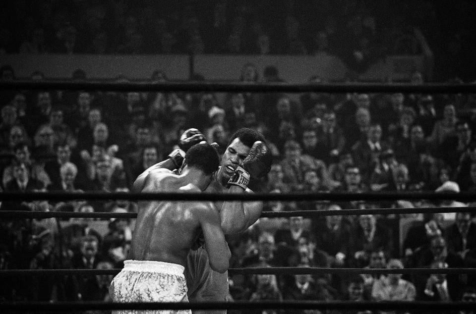 <p>Heavyweight champion Joe Frazier, left, has challenged Muhammad Ali, right, on the ropes during the fourth round of their heavyweight title bout, Monday, March 8, 1971, New York. (AP Photo)</p> 