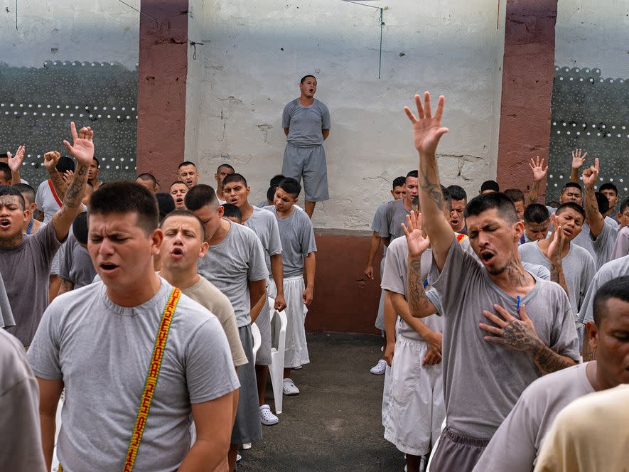 Others at Gotera who have renounced their gang ties pray together. Prison-based evangelical churches in El Salvador are growing. (National Geographic/Karine Aigner)