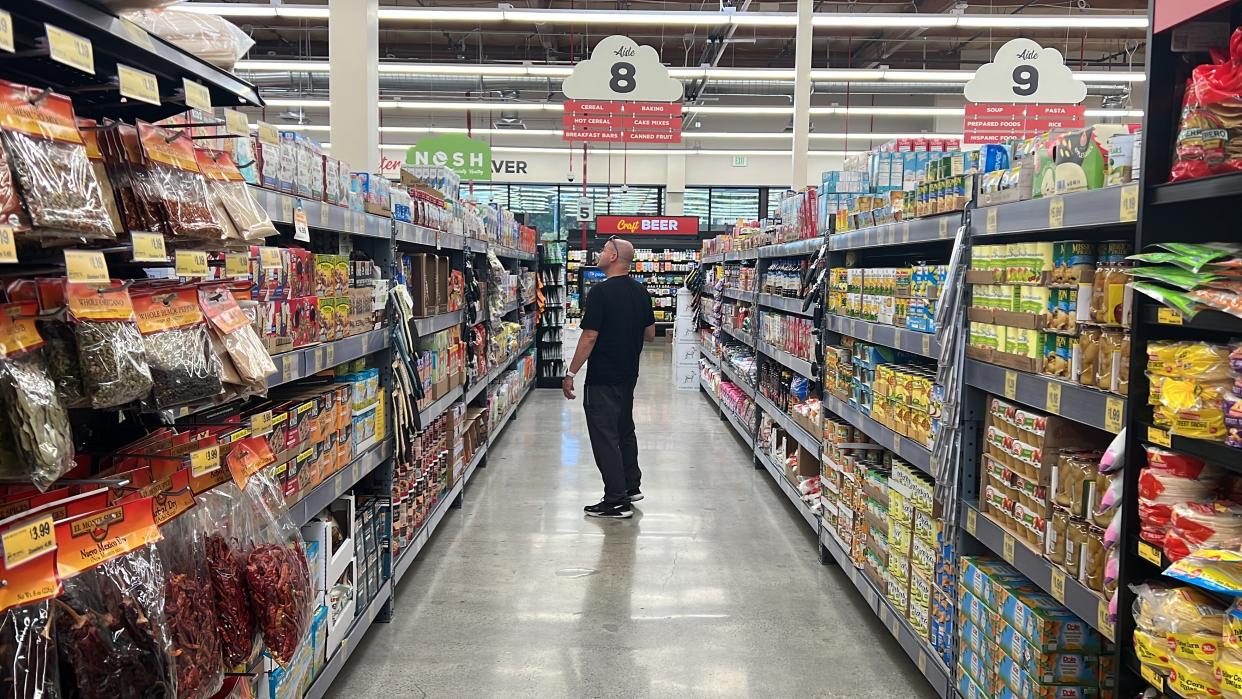 Customer Kevin Amaral shops at a Grocery Outlet store in Pleasanton, Calif., on Thursday, Sept. 15, 2022. "Best before” labels are coming under scrutiny as concerns about food waste grow around the world. Manufacturers have used the labels for decades to estimate peak freshness. But “best before” labels have nothing to do with safety, and some worry they encourage consumers to throw away food that’s perfectly fine to eat. (AP Photo/Terry Chea)