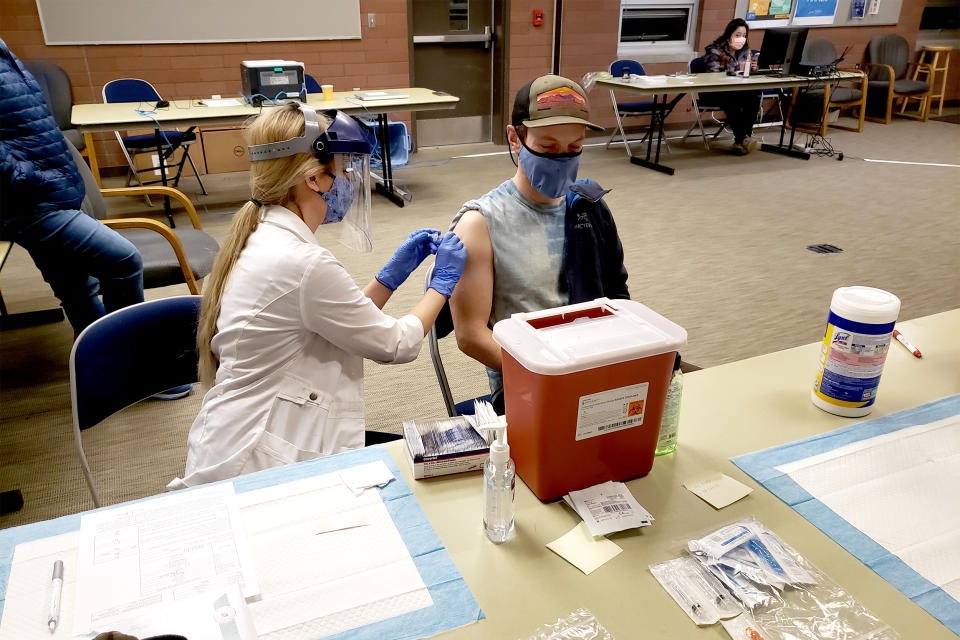 Residents of Sitka, Alaska, receive their Covid-19 vaccinations at the local fire hall during a immunization clinic run by Harry Race Pharmacy and White's Pharmacy earlier this year. (Harry Race Pharmacy and White's Pharmacy)