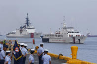 The U.S. Coast Guard National Security Cutter Bertholf (WMSL 750), left, and the Philippine Coast Guard ship BRP Batangas arrive Wednesday, May 15, 2019 in Manila, Philippines, after taking part in a joint exercise off the South China Sea. Capt. John Driscoll, commanding officer of the Bertholf, told reporters that two Chinese Coast Guard ships were spotted off the South China Sea while they were conducting the joint exercise with Philippine Coast Guard. (AP Photo/Bullit Marquez)