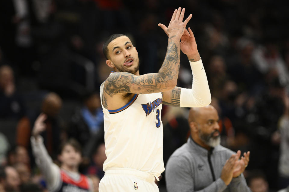 Washington Wizards forward Kyle Kuzma (33) reacts after he made a 3-point basket during the first half of the team's NBA basketball game against the Phoenix Suns, Wednesday, Dec. 28, 2022, in Washington. (AP Photo/Nick Wass)