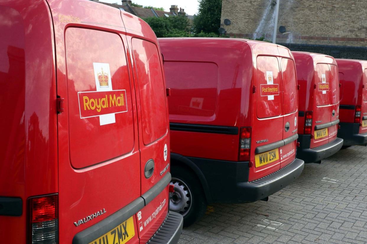 Royal Mail vans are parked in the Leytonstone post office depot in London: REUTERS