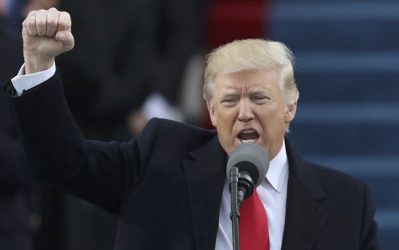 Newly inaugurated U.S. President Donald Trump pumps his fist at the conclusion of his inaugural address during ceremonies swearing him in as the 45th president of the United States on the West front of the U.S. Capitol in Washington, U.S., January 20, 2017. REUTERS/Carlos Barria