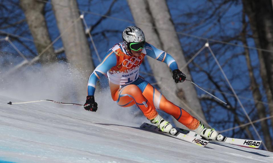 Norway's Aksel Lund Svindal makes a turn during men's downhill training at the Sochi 2014 Winter Olympics, Thursday, Feb. 6, 2014, in Krasnaya Polyana, Russia. (AP Photo/Luca Bruno)