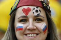 A Russian fan poses before the start of the 2014 World Cup Group H soccer match against Algeria at the Baixada arena in Curitiba June 26, 2014. REUTERS/Damir Sagolj (BRAZIL - Tags: SOCCER SPORT WORLD CUP)