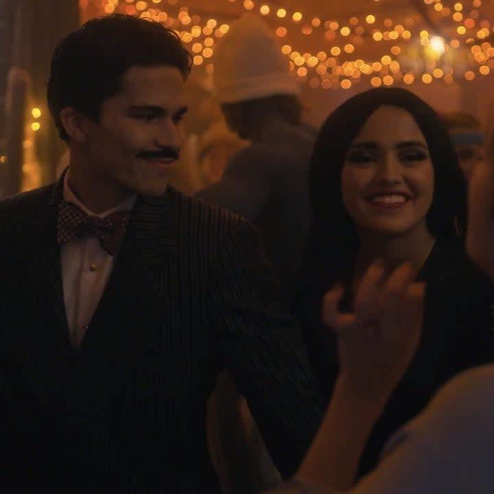 noa and her boyfriend dressed as morticia and gomez addams in pretty little liars original sin