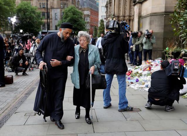 The pair had travelled from nearby Blackburn to offer their prayers and respects. Source: Reuters