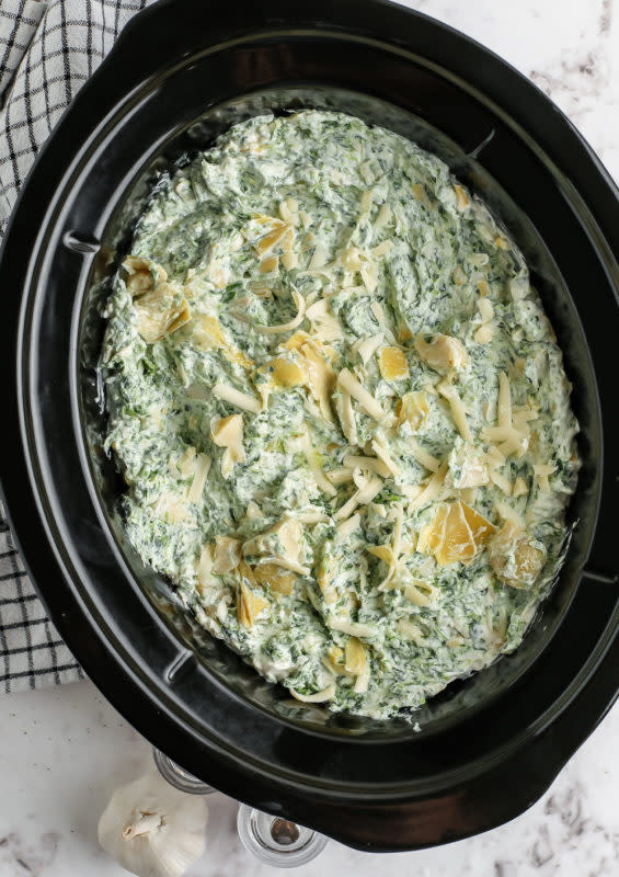 <p>Spend With Pennies</p><p>No party spread is complete without a great spinach artichoke dip, and this one is extra easy!</p><p><strong>Get the recipe: <a href="https://www.spendwithpennies.com/crockpot-spinach-artichoke-dip/" rel="nofollow noopener" target="_blank" data-ylk="slk:Crock Pot Spinach Artichoke Dip;elm:context_link;itc:0;sec:content-canvas" class="link rapid-noclick-resp">Crock Pot Spinach Artichoke Dip</a></strong></p>