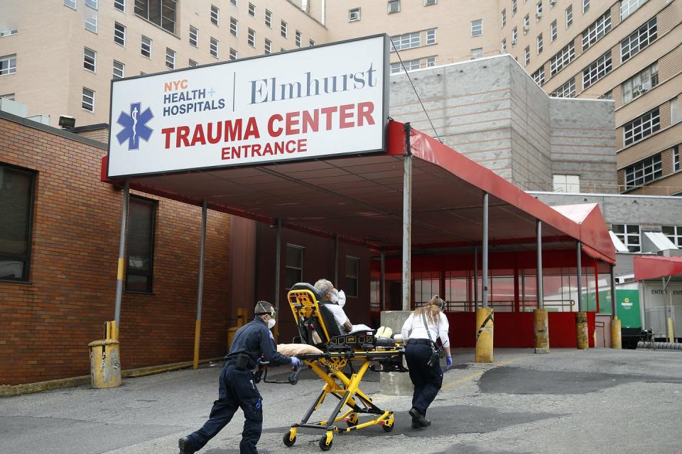 <span class="caption">EMTs bring in a patient to Elmhurst Hospital Trauma Center in New York City. As coronavirus cases rise, those with substance use disorders become even more vulnerable.</span> <span class="attribution"><a class="link " href="https://www.gettyimages.com/detail/news-photo/s-bring-in-a-patient-to-elmhurst-hospital-trauma-center-in-news-photo/1211060945?adppopup=true" rel="nofollow noopener" target="_blank" data-ylk="slk:Getty Images / NurPhoto;elm:context_link;itc:0;sec:content-canvas">Getty Images / NurPhoto</a></span>