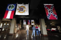 Visitors view exhibits at the National Confederate Museum on June 6, 2021, in Columbia, Tenn. With the approval of relatives, the remains of Confederate Gen. Nathan Bedford Forrest will be moved from Memphis, Tenn., to the museum. (AP Photo/Mark Humphrey)