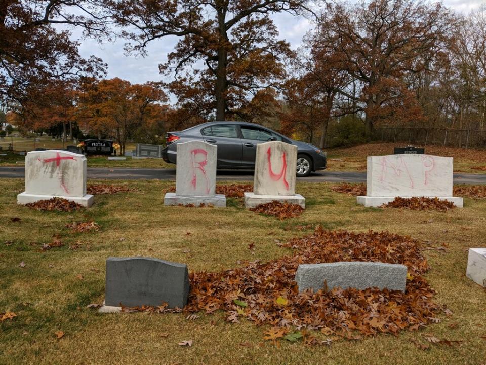 'TRUMP' painted in red across four graves at a Michigan cemetery.