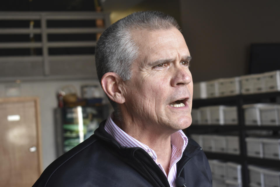 In this Oct. 6, 2018 photo Republican State Auditor Matt Rosendale discusses his campaign to defeat Montana Democratic U.S. Sen. Jon Tester at a campaign event at Lonewolf Energy in Billings, Mont. Rosendale trails in fundraising but he's stayed competitive with $14 million spent by deep-pocketed conservative groups on his behalf. (AP Photo/Matthew Brown)