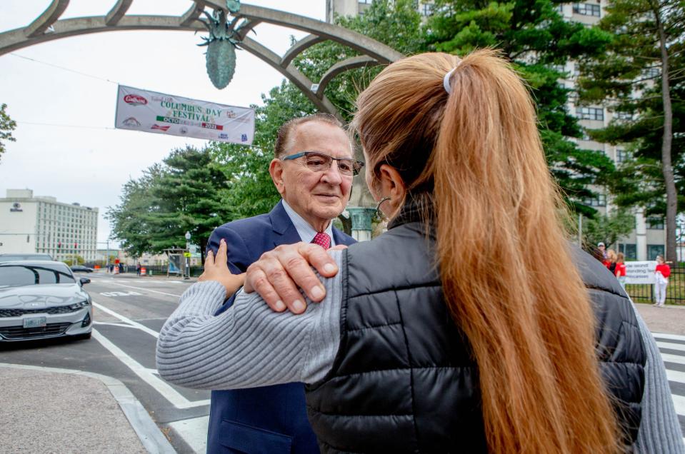 Judge Frank Caprio greets well-wishers under the Federal Hill arch during 2021 Columbus Day festivities.