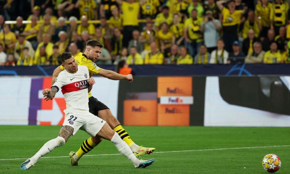 <span>Niclas Füllkrug fends off PSG’s Lucas Hernández to score the only goal of the first leg.</span><span>Photograph: Thilo Schmülgen/Reuters</span>