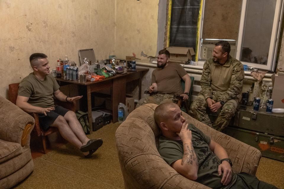 Ukrainian servicemen of the 80th Separate Galician Air Assault Brigade watch the UEFA Euro 2024 football match between Romania and Ukraine, in a house converted to a military base, in the Donetsk region (AFP via Getty Images)