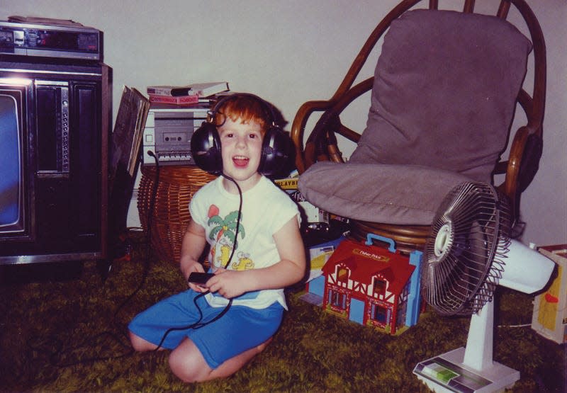 Chris Giarmo listens to music at his childhood home in Paramus.