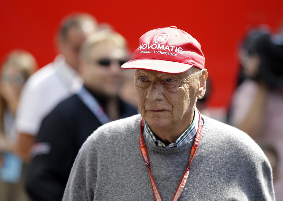 FILE - In this July 7, 2018, file photo, former Formula One World Champion Niki Lauda of Austria walks in the paddock before the third free practice at the Silverstone racetrack, Silverstone, England. Three-time Formula One world champion Niki Lauda, who won two of his titles after a horrific crash that left him with serious burns and went on to become a prominent figure in the aviation industry, has died. He was 70. The Austria Press Agency reported Lauda's family saying in a statement he "passed away peacefully" on Monday, May 20, 2019. (AP Photo/Luca Bruno, File)