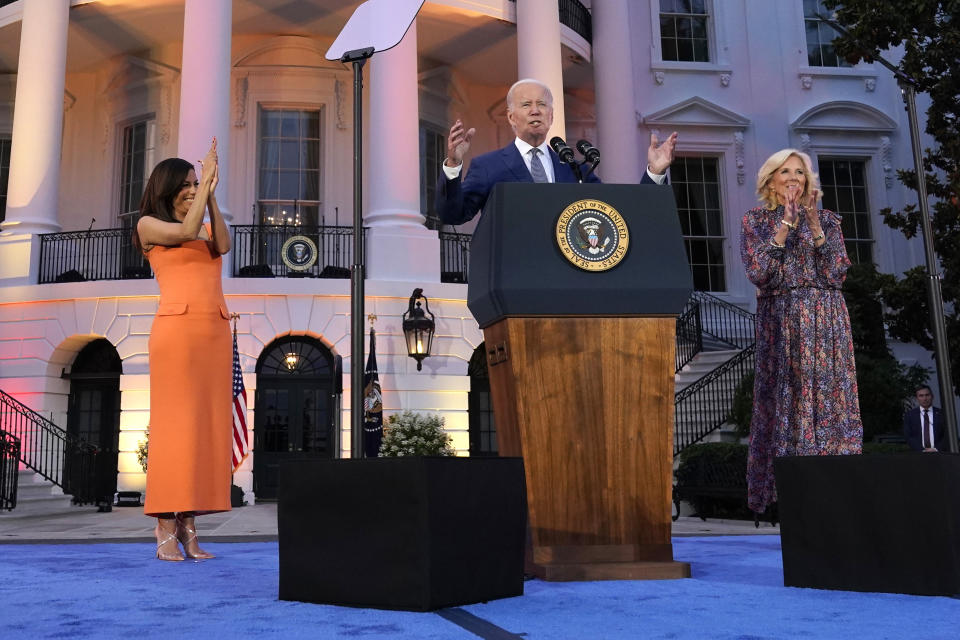 President Joe Biden, with first lady Jill Biden and Eva Longoria, speaks before a screening of the film "Flamin' Hot," Thursday, June 15, 2023, on the South Lawn of the White House in Washington. (AP Photo/Jacquelyn Martin)