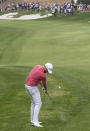 Chris Kirk hits his approach shot on the 18th hole during the first round of the Valero Texas Open golf tournament, Friday, March 31, 2023, in San Antonio. (AP Photo/Rodolfo Gonzalez )