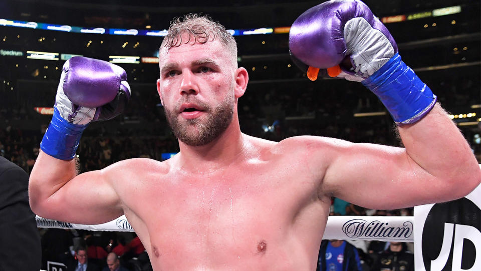 Billy Joe Saunders in the ring raising his gloves.