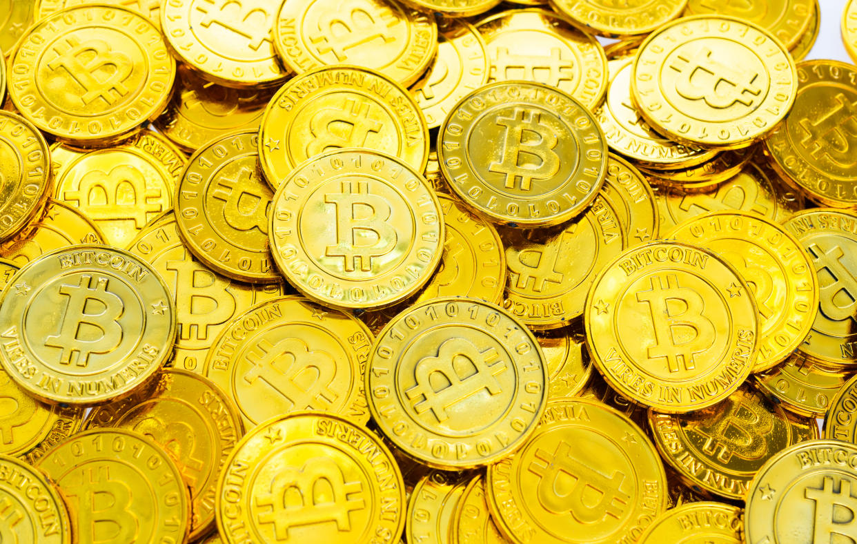 A pile of memorial golden bitcoins.