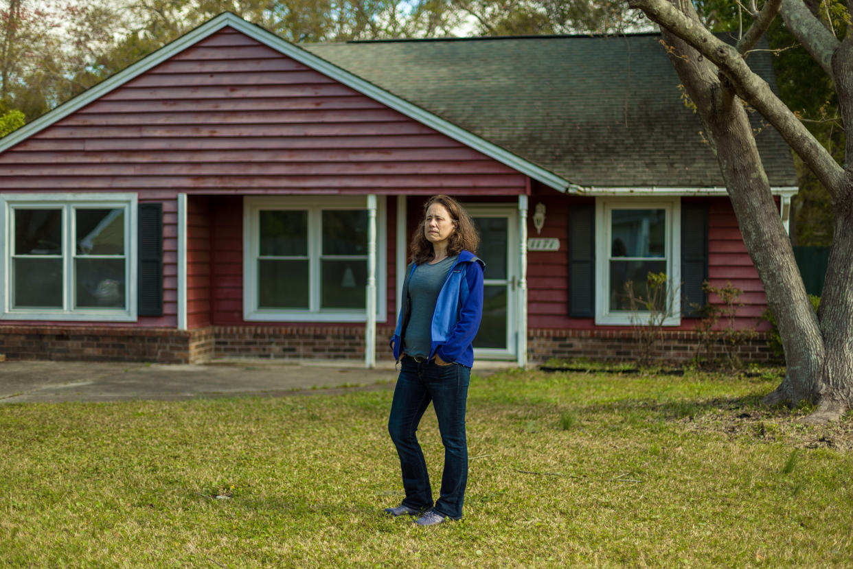Ana Zimmerman stands in front her former home. that she owned the home between 2005 and 2019.