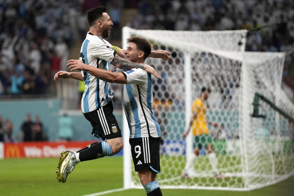 Argentina's Julian Alvarez, right, and Lionel Messi, left, celebrate their side's second goal during the World Cup round of 16 soccer match between Argentina and Australia at the Ahmad Bin Ali Stadium in Doha, Qatar, Saturday, Dec. 3, 2022. (AP Photo/Frank Augstein)