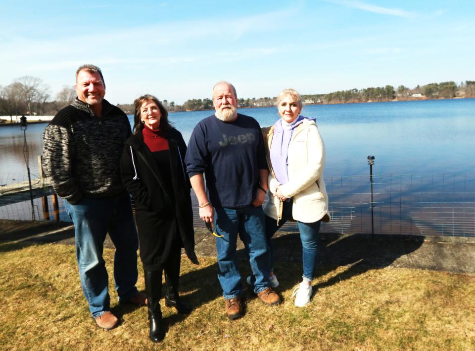 From left, Taunton City Councilor John McCaul, and waterfront residents on Lake Sabbatia Lisa Potter, Craig DeMoura and Pegi Conte at Lake Sabbatia on Friday, March 11, 2022. 