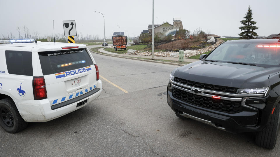 Police block entrance to evacuated neighbourhood of Beacon Hill, Fort McMurray, Alta.