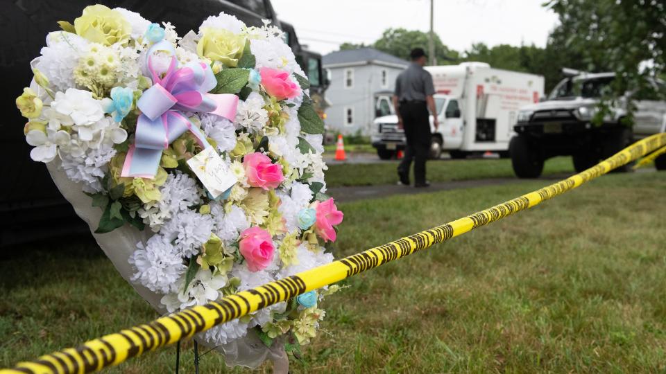 A memorial stands near the scene of a deadly house explosion, that took place in Buena, NJ on Thursday, as crews work the site on Friday, August, 4, 2023.  